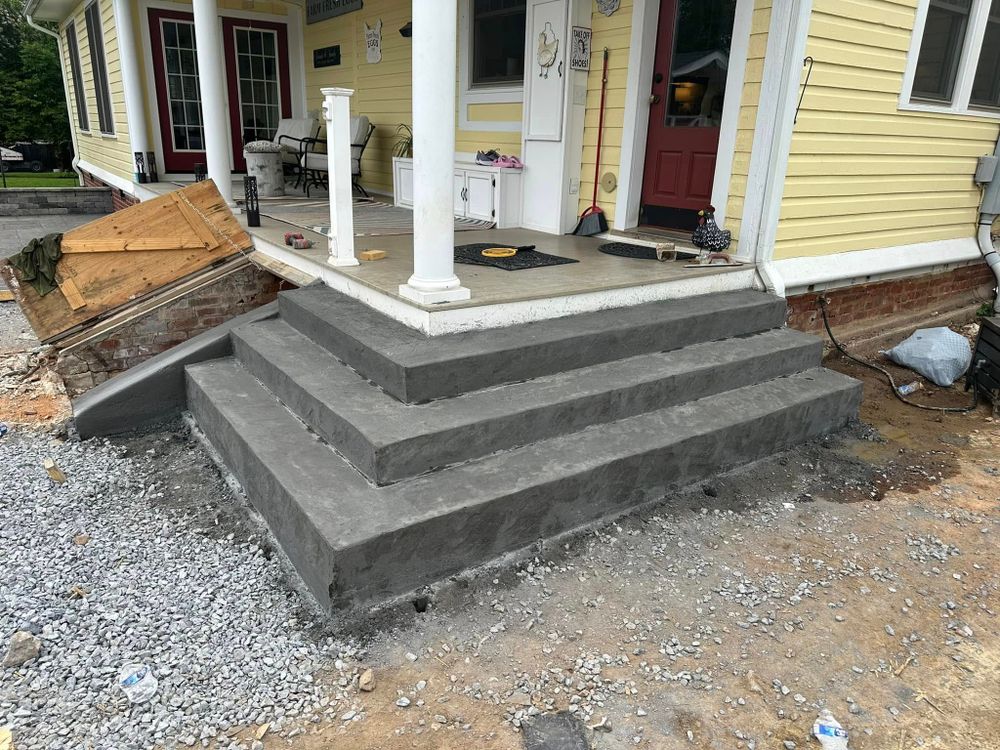 Transform your home with our expert Stair Design & Installation service, offering durable and stylish concrete solutions that blend functionality with modern aesthetics to perfectly complement your space. for Whorley Concrete Construction in Goode, VA