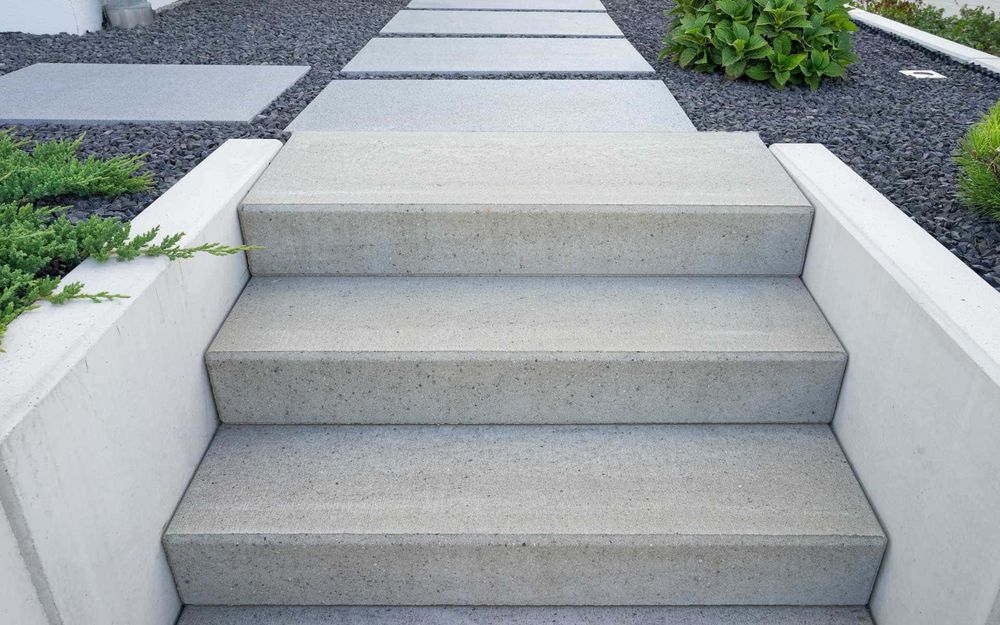 Our Stair Design & Installation service offers homeowners customized and expertly crafted concrete stair designs to enhance the aesthetic appeal and functionality of their outdoor spaces. for Dunwell Concrete in Seattle, WA