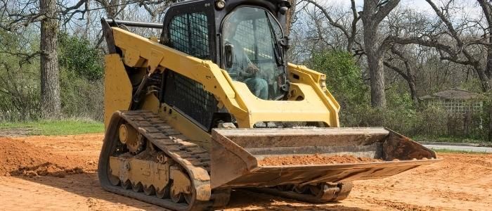 Enhance your property's beauty and accessibility with our Skid Steer Work service, expertly clearing debris, leveling terrain, and preparing land for landscaping or construction efficiently and safely. for Hawkins Tree Service & Land Management in Richmond Hill, GA