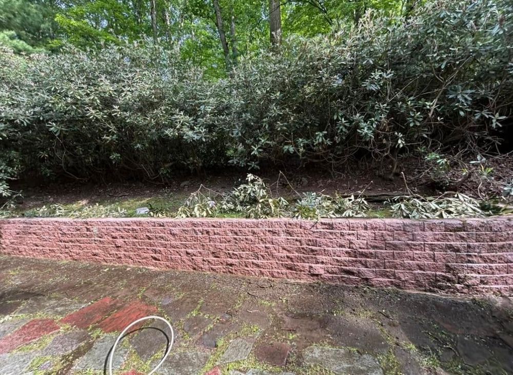 Our Retaining Wall Construction service enhances your outdoor space by providing durable, aesthetically pleasing walls that prevent erosion, manage water flow, and increase usable yard area for a beautiful landscape transformation. for K Enterprises in Tamaqua, PA