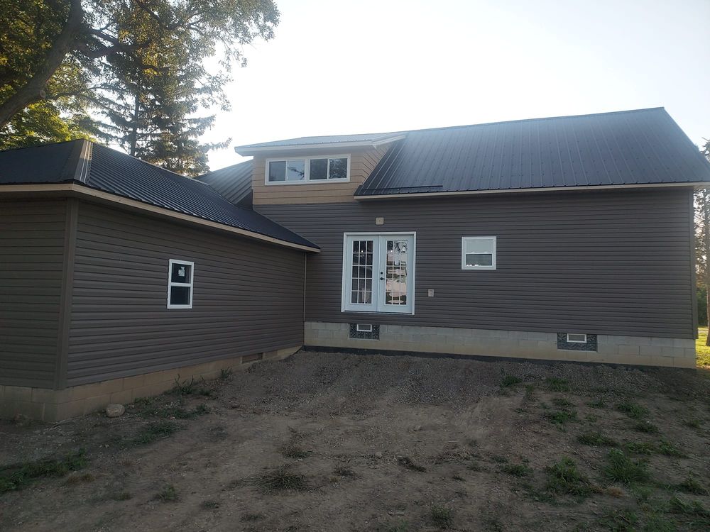 Enhance your home's curb appeal and protection with our expert vinyl siding services. Durable, energy-efficient, and aesthetically pleasing, our installation ensures long-lasting beauty and comfort for your home. for Jays Roofing and Construction in Toledo, Ohio