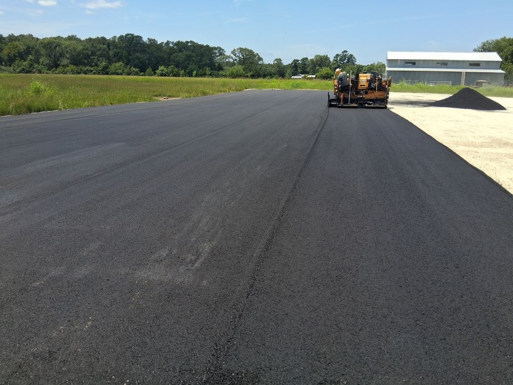 Our Parking Lot Construction service transforms residential spaces with durable, high-quality asphalt paving, ensuring enhanced safety and aesthetics while providing efficient drainage to increase property value and curb appeal. for T.B.E Asphalt Paving in Spring, TX