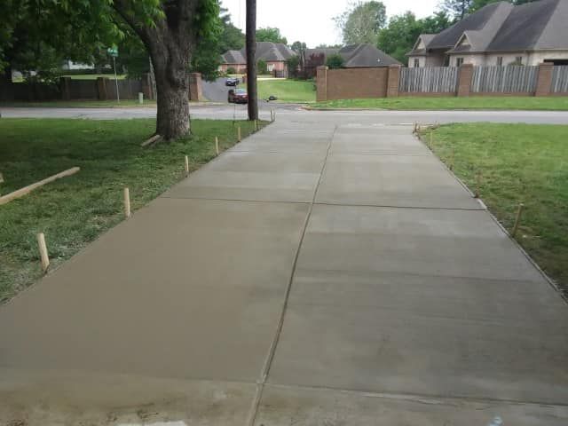 Transform your home's exterior with our expert stamped concrete installation service, providing durable and stylish driveways that enhance curb appeal while offering long-lasting functionality for all your vehicle needs. for R&C Concrete in Jonesboro, AR