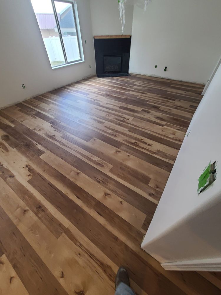 Enhance your home's elegance with our expert wood flooring services, offering a seamless blend of style and durability to transform any space into a warm, inviting environment while complementing existing tile designs. for Cox Tile and Stone in Clinton, UT