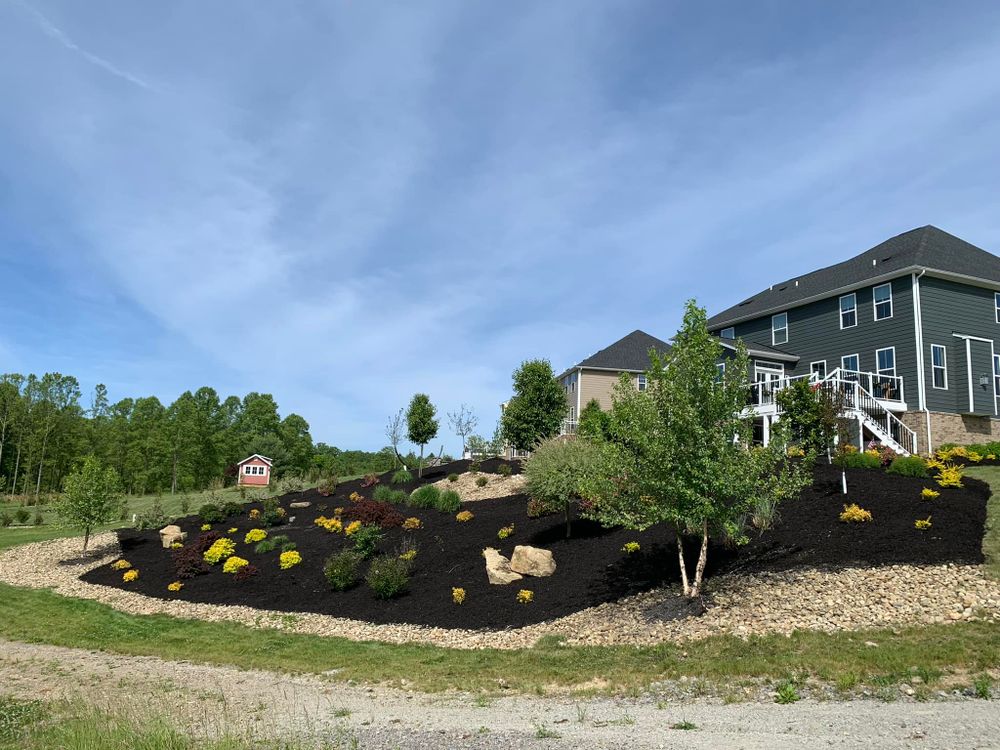 Our Mulch Installation service offers homeowners a cost-effective and efficient way to improve the appearance of their landscaping while also providing essential nutrients and moisture retention for plants. for Trueman Landscaping in Wexford, PA