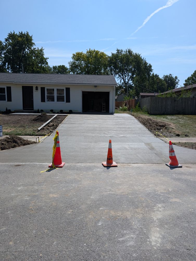 Transform your home with our expert concrete slab construction service for driveways. Enhance curb appeal, durability, and value with our skilled team creating a beautiful and functional new driveway for you. for Indy Elite Concrete in Arcadia, IN