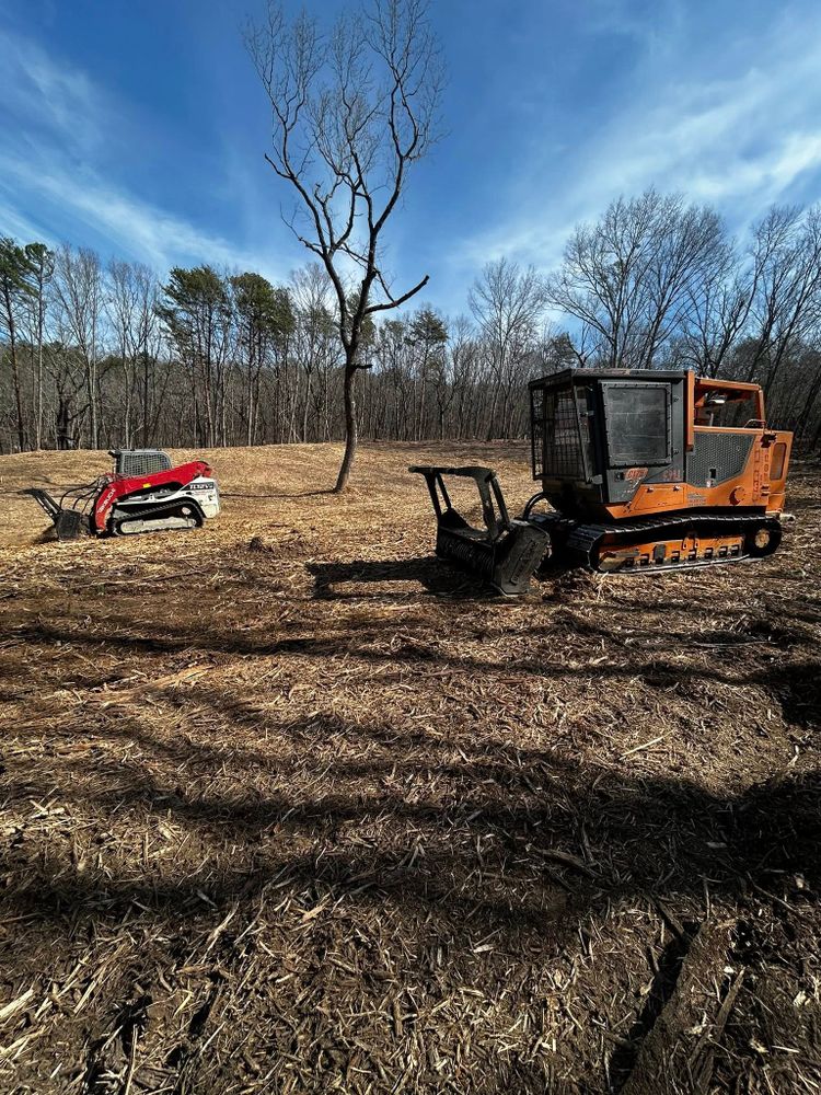 Our Forestry Mulching service provides efficient land clearing by turning unwanted vegetation into nutrient-rich mulch, enhancing soil health and promoting natural growth through professional mulch installation tailored to your property's needs. for HRW Land Services in Canton, GA