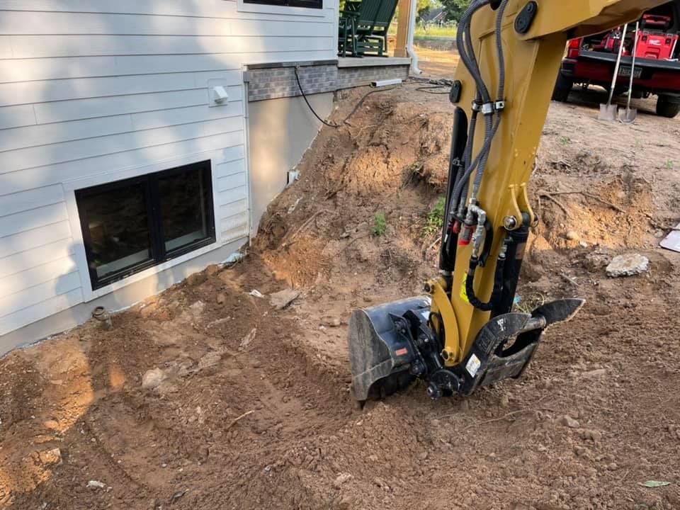 Our excavation service includes digging and removing soil from your property to create a level surface for landscaping projects such as building retaining walls, installing water features, or planting gardens. for R&R Outdoor Services LLC  in Lino Lakes, MN