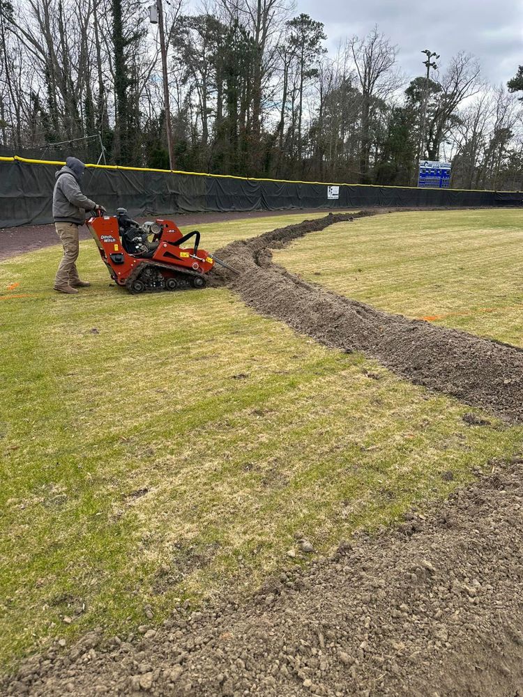 Our Field Drainage service effectively manages excess water to protect your field from waterlogging, erosion, and other damage, ensuring healthy turf and safe playing surface year-round. for Fowler's Turf & Grading in Virginia, Virginia