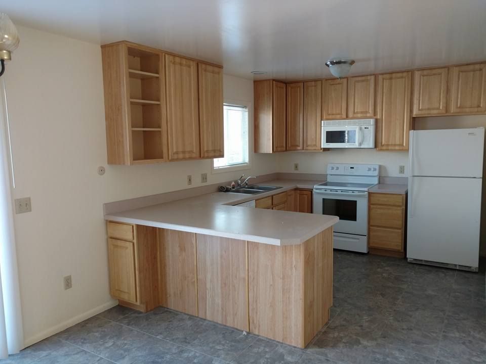 Our Kitchen and Cabinet Refinishing service offers homeowners an affordable way to update their kitchen by giving cabinets a fresh new look through painting or refinishing techniques. for Paints Well With Colors in Billings, MT