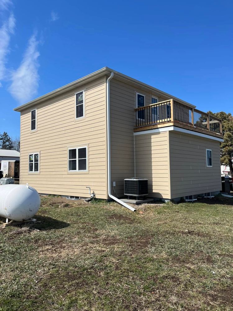 Enhance your home's curb appeal and energy efficiency by choosing our expert siding service. We specialize in transforming your residence into a stunning vinyl siding house with durable, low-maintenance materials. for SC Specialties in Centerville, SD