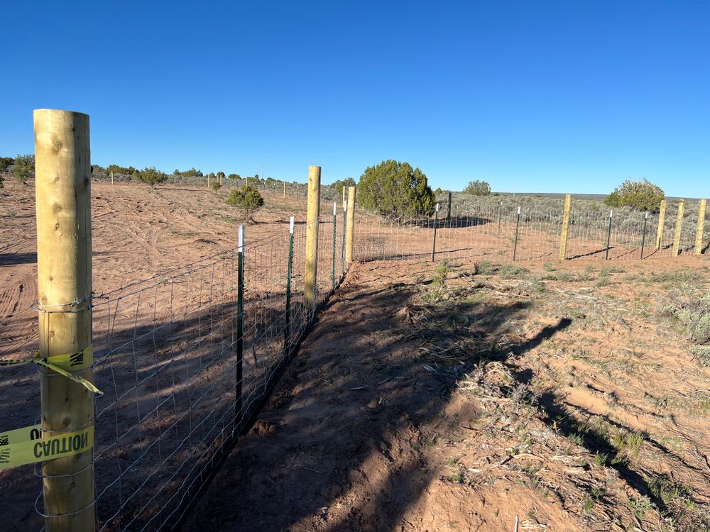 Enhance your property's security and aesthetics with our expert fencing services. We offer custom designs, durable materials, and professional installation to ensure lasting quality that complements your home's unique style. for Creative Native Construction in Flagstaff, AZ