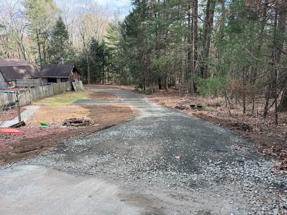 We offer new driveway excavation and installation using superior aggregate. We also offer black top removal, grading for asphalt preparation & gravel driveway maintenance to keep your roadways and parking areas in top shape. for Lennon Land Management in Suffield, CT