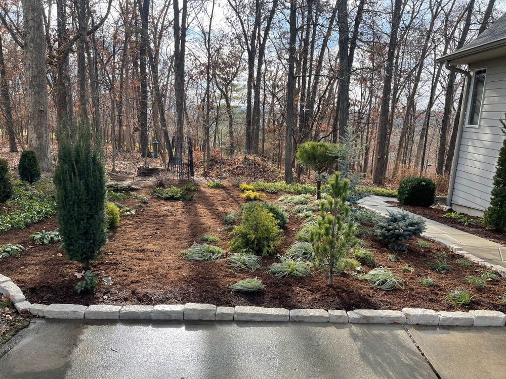 Enhance your garden's aesthetic appeal with our Mulch Installation service. Our team will expertly spread mulch to suppress weeds, retain moisture, and improve soil health for a vibrant landscape. for J & B Landscaping in St. Louis, MO