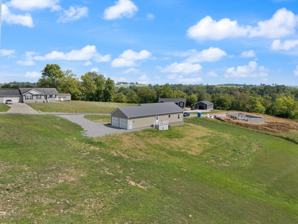 Our Pole Barn Construction service offers durable, custom-designed structures perfect for storage or workspace needs, built with quality materials and expert craftsmanship to enhance your property's functionality and aesthetic appeal. for Brudah Builds in Flemingsburg, KY