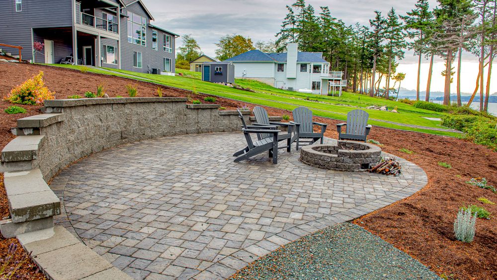 Enhance your outdoor living space with our expertly crafted paver patios. Our skilled team will design, install, and maintain a beautiful patio that complements your home's landscape seamlessly. for SodGods Lawncare and Landscaping in Fayetteville , NC