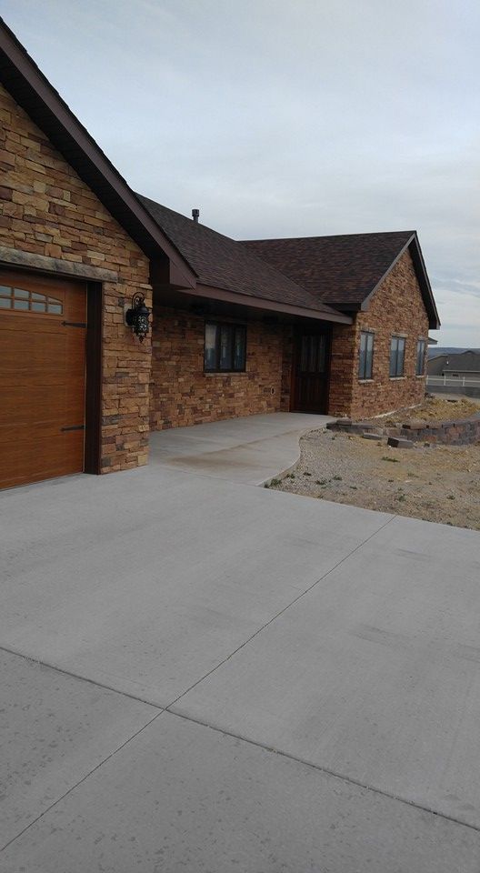 Transform your home's exterior with our professional driveway paving service. Enhance curb appeal, increase property value, and enjoy a durable and stylish concrete driveway tailored to your needs. for BW Construction in Rawlins, WY