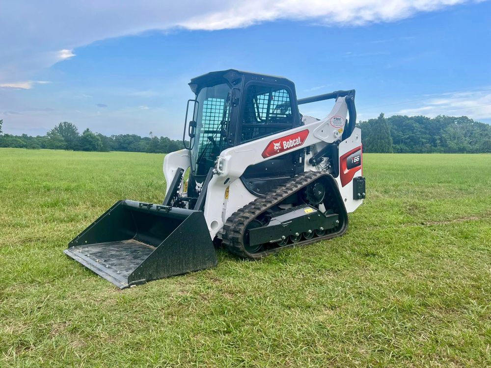 Our Skid Steer Work service offers precision and efficiency for your landscaping and excavation needs, ensuring smooth grading, clearing debris, or preparing foundations to enhance your home's outdoor space effortlessly. for Advantage Rental And Services in Youngsville, NC