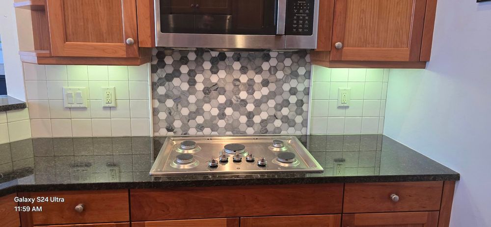 Enhance your kitchen's aesthetics and functionality with our expert backsplash tiling service, offering a stylish selection of materials and precise installation for a seamless blend with your existing décor. for Phoenix Remodel in Boston, Massachusetts