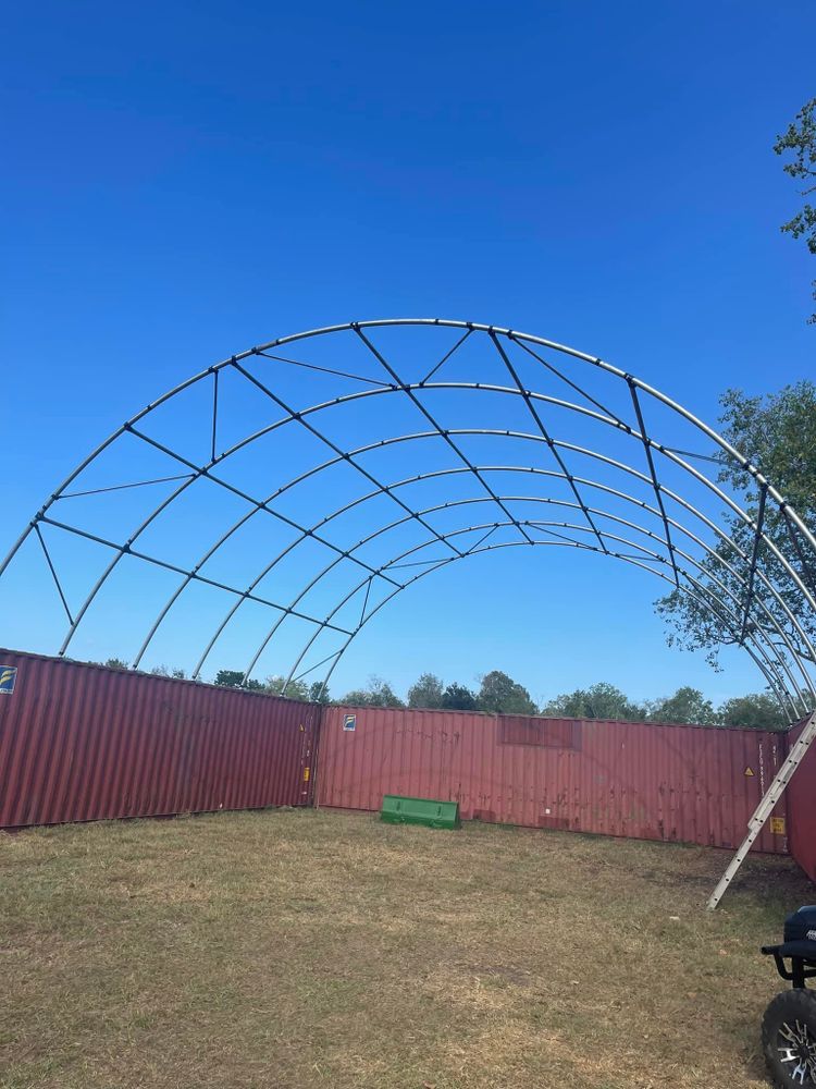 Enhance your property with our durable metal building solutions, perfect for storage or workshops. Our expertly crafted structures offer reliability and versatility, seamlessly complementing the quality of our fencing services. for Longhorn Fence & Land Development in Webster, TX