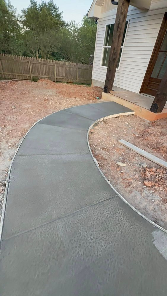 Our Sidewalk Installation service provides homeowners with durable, aesthetically pleasing walkways designed to enhance safety and curb appeal. We ensure precise installation using high-quality concrete for long-lasting results. for DMGZ Concrete LLC in Winston-Salem, NC