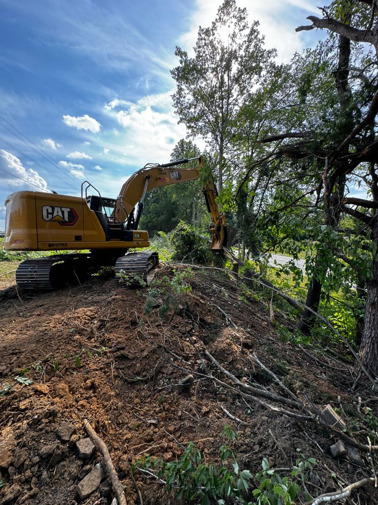 Our Land Clearing service helps homeowners transform overgrown or undeveloped land into usable space by removing trees, brush, and debris efficiently and safely to create a clean canvas for future projects. for Cone Grading and Land Clearing in Summerfield, NC