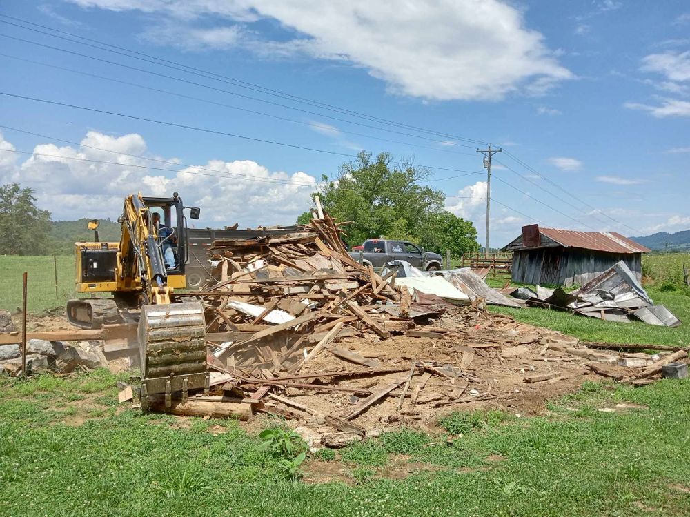 Our Land Clearing & Demolition service efficiently prepares your site for new projects, ensuring safe and thorough removal of debris, trees, and structures to create a clean slate for construction. for Walker Excavation in Tazewell, TN