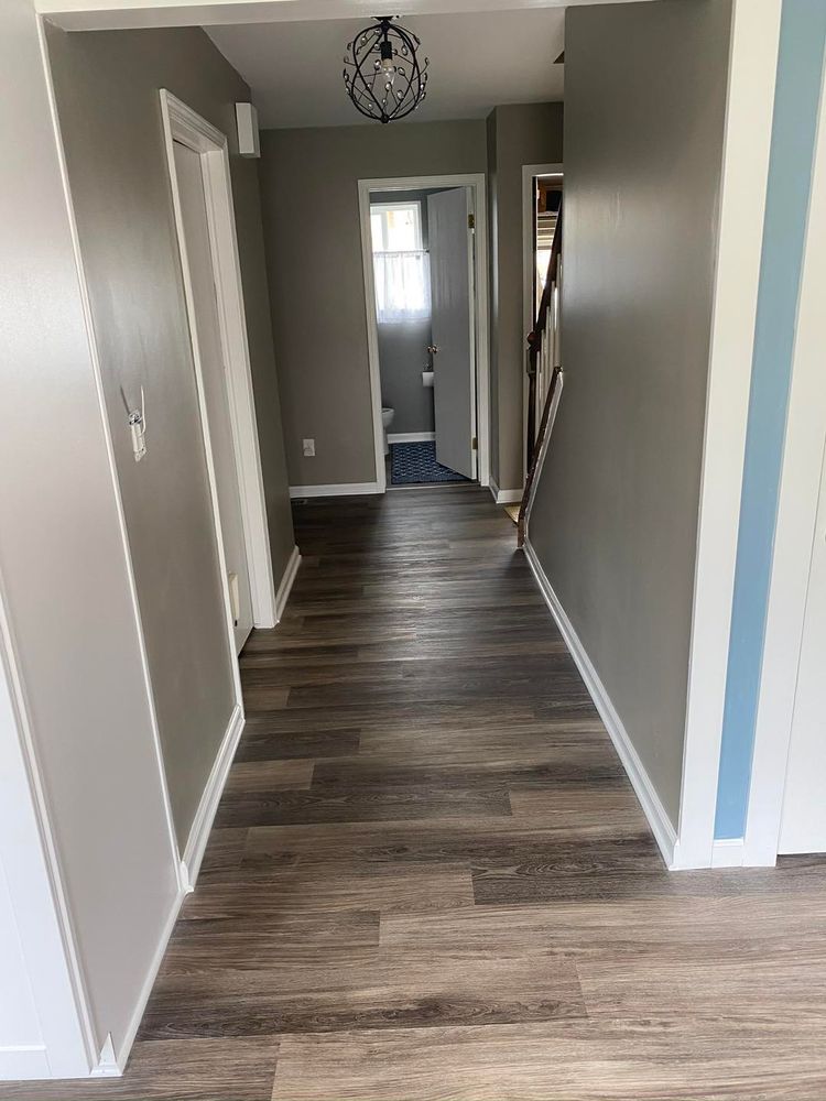 Our Flooring service provides high-quality installation and replacement of various flooring options, including hardwood, laminate, tile, bamboo and vinyl plank. Enhance the beauty and functionality of your home with our expert team. for A Cut Above Remodels LLC  in Oakland County,  MI