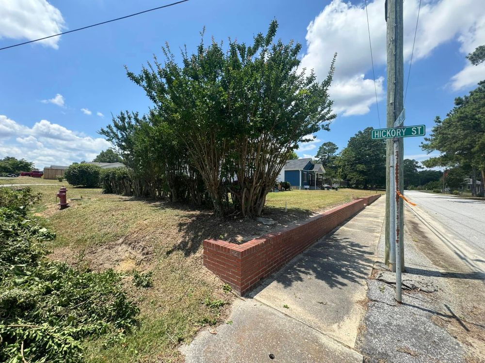Our Retaining Wall Construction service enhances your landscape’s functionality and beauty, effectively managing soil erosion and creating stunning tiered designs that blend seamlessly with your outdoor environment. Perfect for stability and style. for Thin Green Line Landscaping & More in Laurens, SC