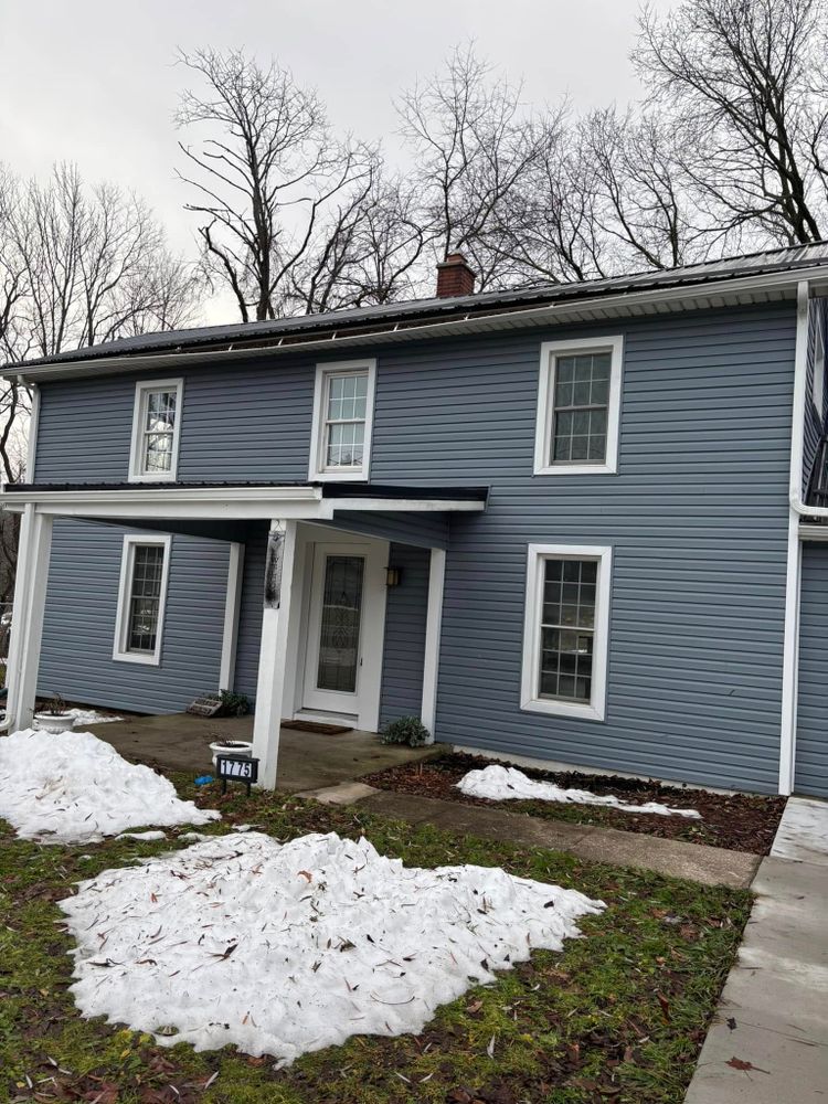 Enhance your home's exterior with our expert vinyl siding house services. Our team delivers durable, stylish solutions to improve curb appeal and provide long-lasting protection for your home investment. for Roache Construction in Erie, PA