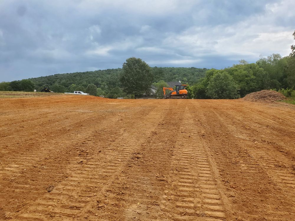 Enhance your property's landscape with our expert Land Grading service, ensuring proper drainage and a level foundation for future projects, while preventing erosion and water pooling around your home. for H&H Earthworks in Decherd, TN