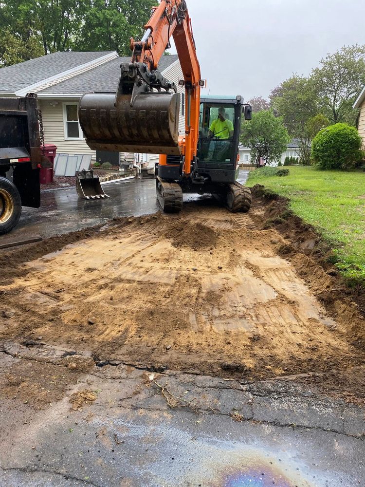 Our Leveling service ensures a smooth, even foundation for your construction projects by expertly adjusting terrain elevations, preventing drainage issues and ensuring structural integrity for homes and landscapes. for Davis Services LLC in Bethany, CT