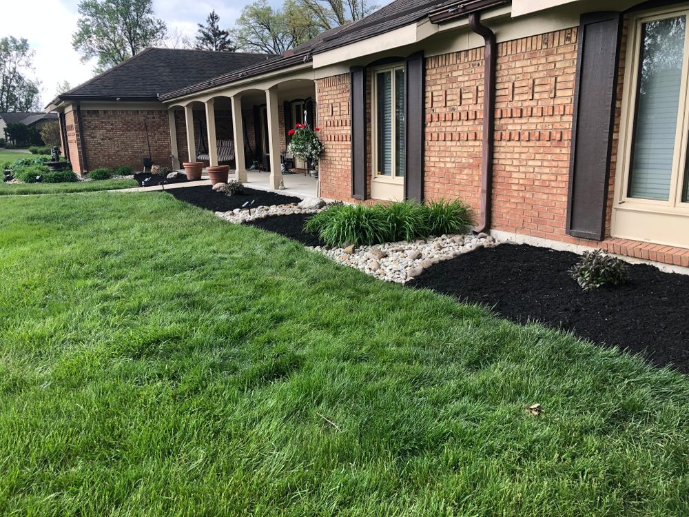 Enhance your garden's aesthetic appeal with our Mulch Installation service. Our team will expertly spread mulch to suppress weeds, retain moisture, and improve soil health for a vibrant landscape. for OneCallCuts in Middletown, OH