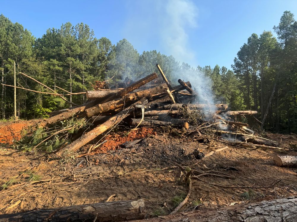 Our Land Clearing & Demolition service efficiently prepares your property for new projects, ensuring safe and environmentally-friendly removal of unwanted structures, debris, and vegetation for a fresh landscape start. for Under Grace Transport and Grading in Marble Hill, GA