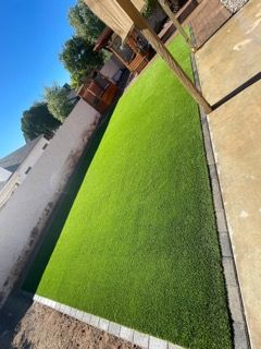 Transform your outdoor space with our Turf Solutions service, offering lush, low-maintenance synthetic grass that enhances beauty and usability while saving time on lawn care. Perfect for a stunning year-round landscape. for Ruiz Patio Designs in Phoenix, AZ
