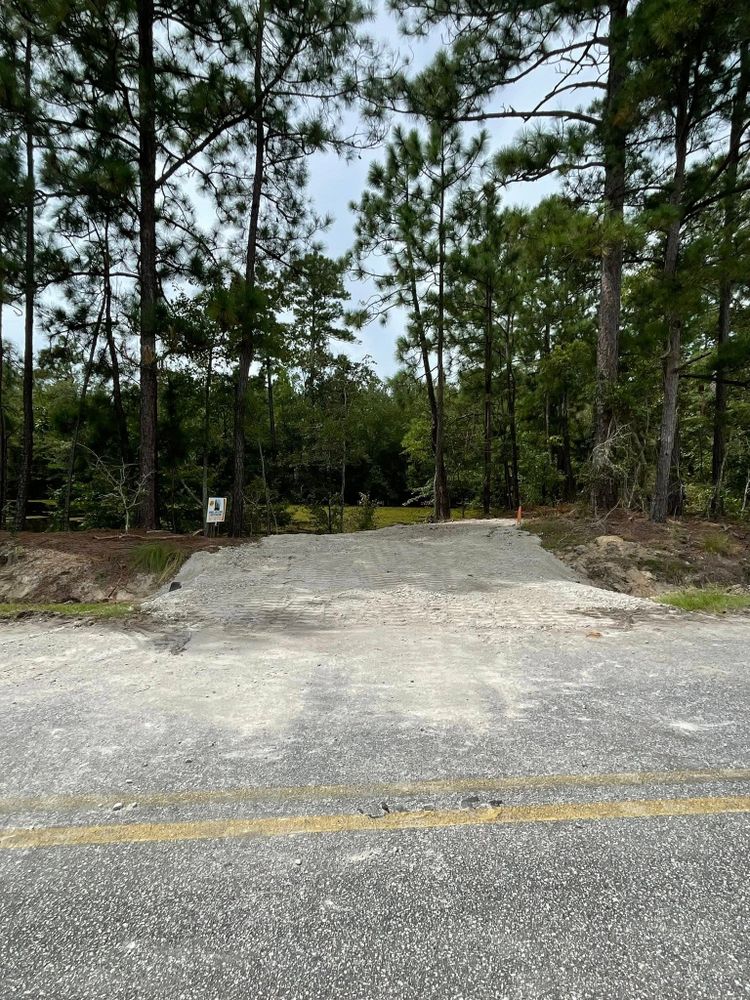 Enhance your home's curb appeal with our gravel driveway service. We provide expert installation and maintenance, ensuring a durable, cost-effective solution tailored to your property's unique needs and aesthetic preferences. for Barnhill land clearing LLC in Horry County, SC