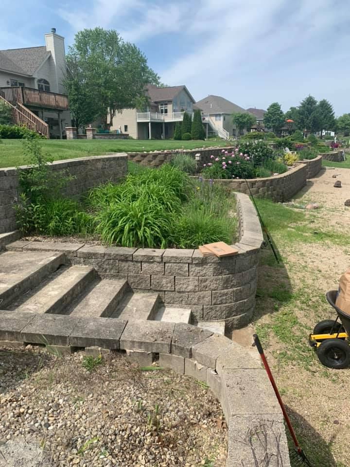 Enhance your outdoor space with our expert retaining wall construction, offering both functionality and style. Our durable designs prevent erosion while adding an elegant touch to your landscaping. Transform your property today! for Cena Landscaping in Rockford, IL