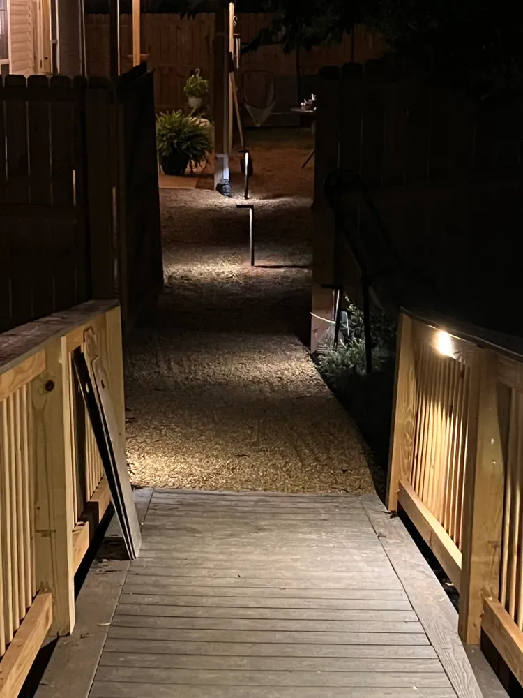 Enhance your home's ambiance with our expert outdoor lighting services, perfectly complementing your outdoor furniture and creating a beautifully illuminated space ideal for relaxation and entertainment in any new construction or remodeling project. for Rescue Construction LLC in Marietta, SC