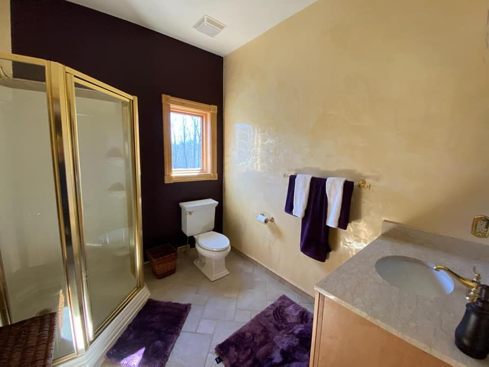 Our Wet Shower Enclosures service offers custom-designed, waterproof solutions that seamlessly integrate with veneitian plaster walls, enhancing elegance and durability in your bathroom for a luxurious yet functional shower experience. for Crown General Contracting in Free Union, VA