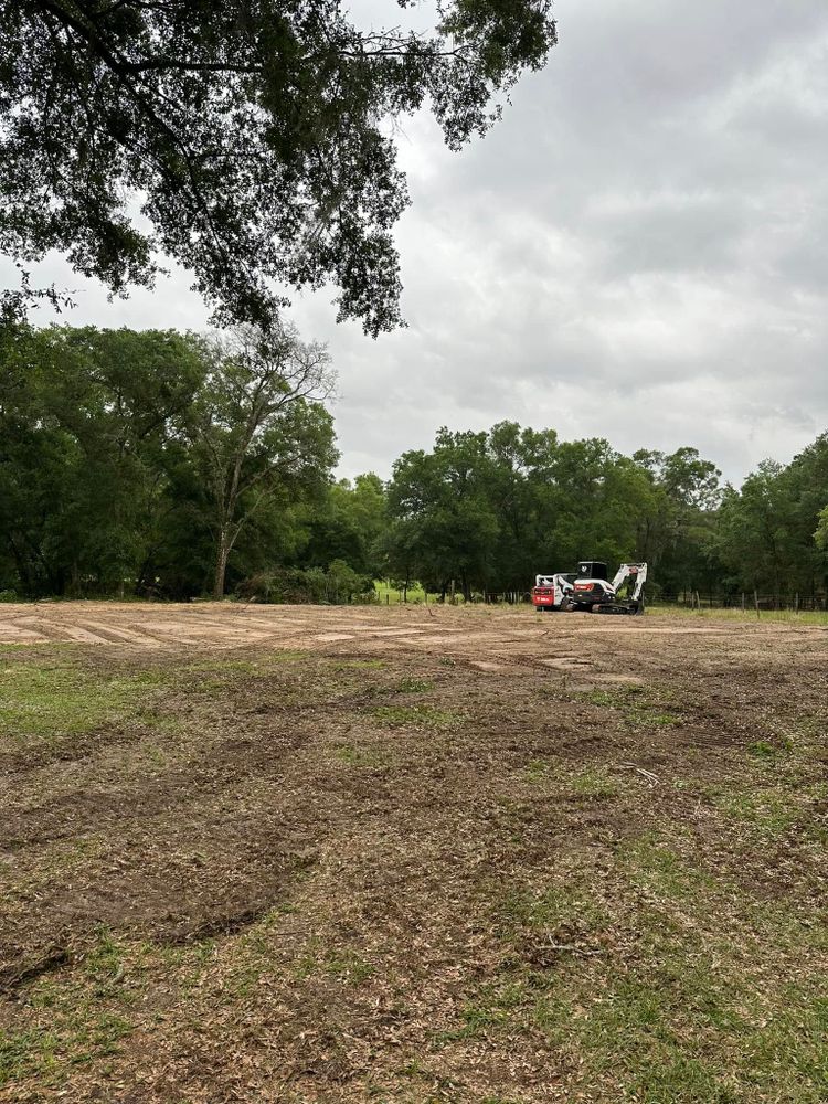 Our Skid Steer Work service efficiently handles residential projects, offering precise grading, debris removal, and landscaping to enhance your property's appearance while ensuring a seamless process with minimal disruption. for Orange Cypress Land Services in DeLand, FL