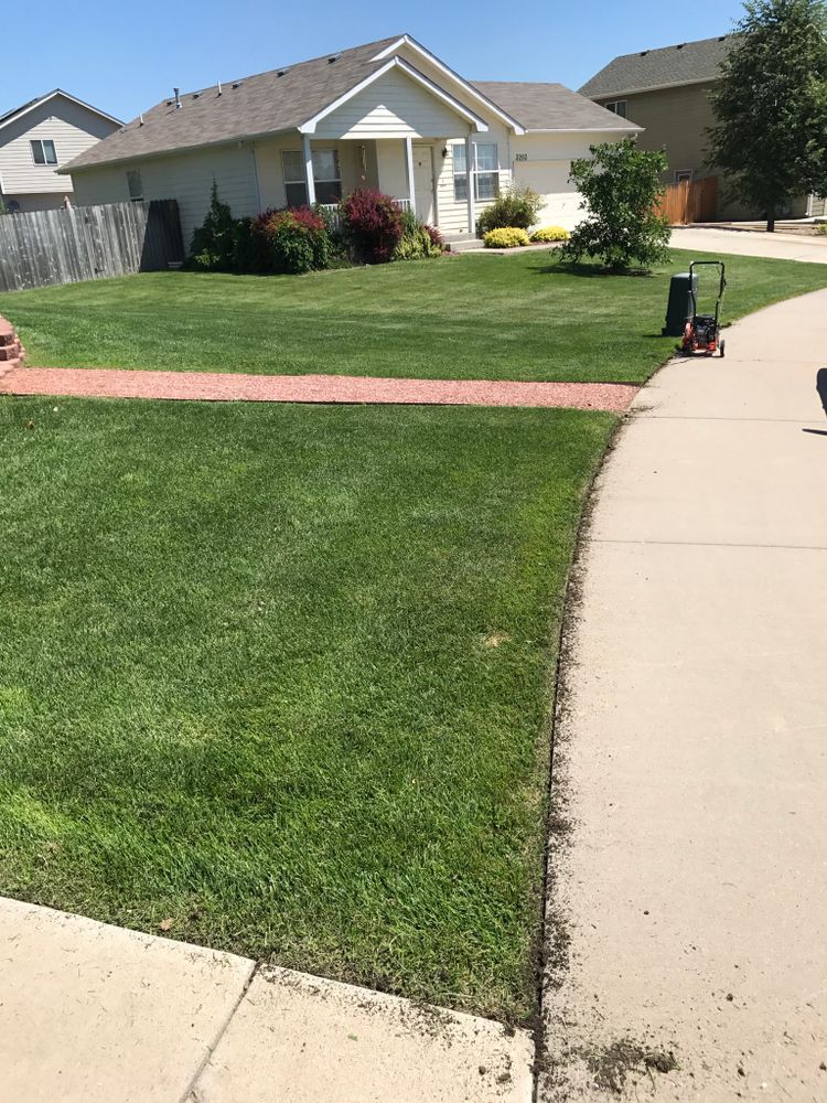 Enhance your landscape's appeal with our professional edging service, creating clean, defined borders between garden beds and lawns for a polished look that boosts both curb appeal and maintenance ease. for Rock Masters Inc. in Evans, CO