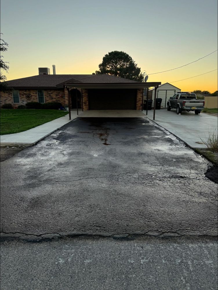 Our Seal Coating service protects and extends the life of your driveway by providing a durable, weather-resistant layer that prevents cracks, reduces wear, and enhances your property's appearance. for Adams Asphalt & Sealcoating in Lubbock, TX