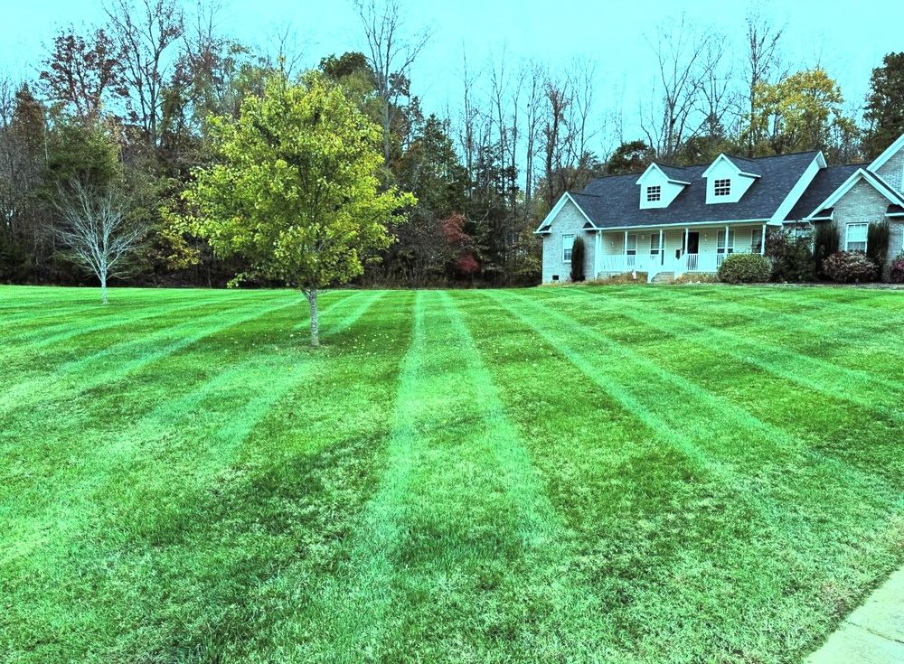 Our professional mowing service ensures your lawn is maintained to perfection, with a skilled team using top-notch equipment and techniques for a beautiful and healthy landscape. for Piedmont Lawn and Landscaping in Lexington, NC