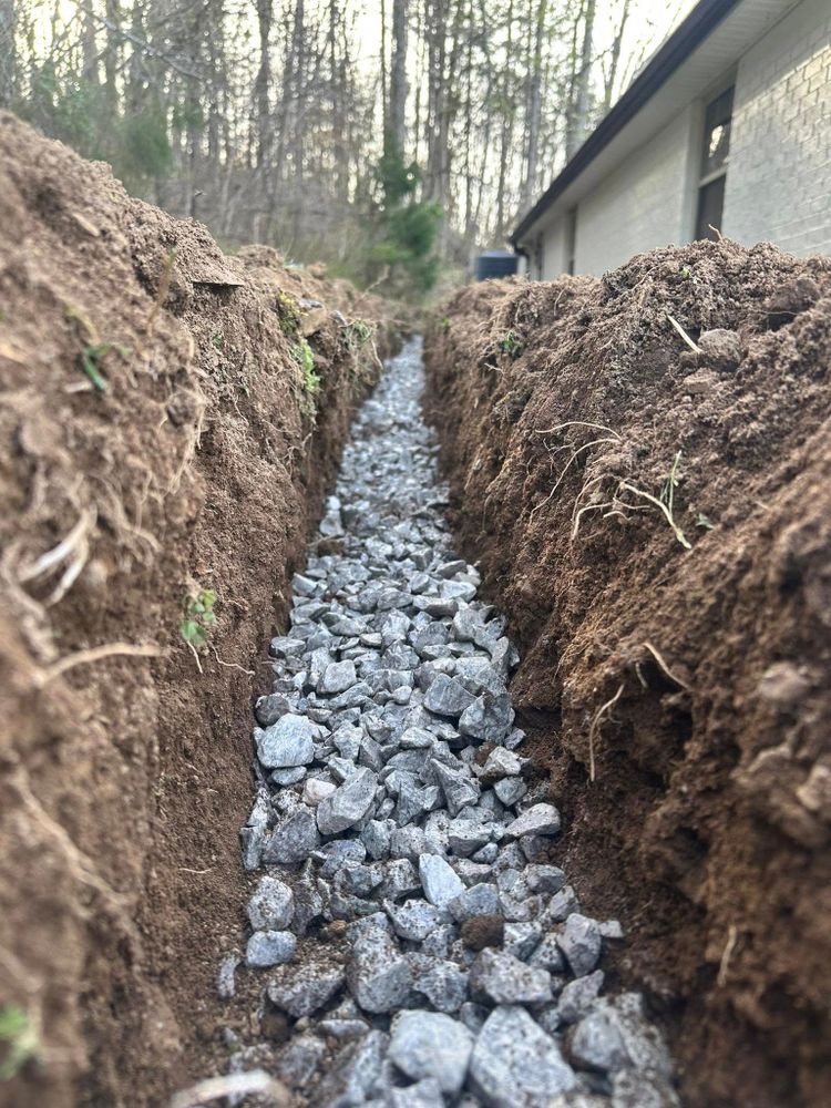 Our Custom Drainage Solutions ensure effective water drainage, preventing property damage. We design tailored systems to manage excess water efficiently, protecting your home and landscape from potential flooding and erosion issues. for Oaks Excavating in Lyles, TN