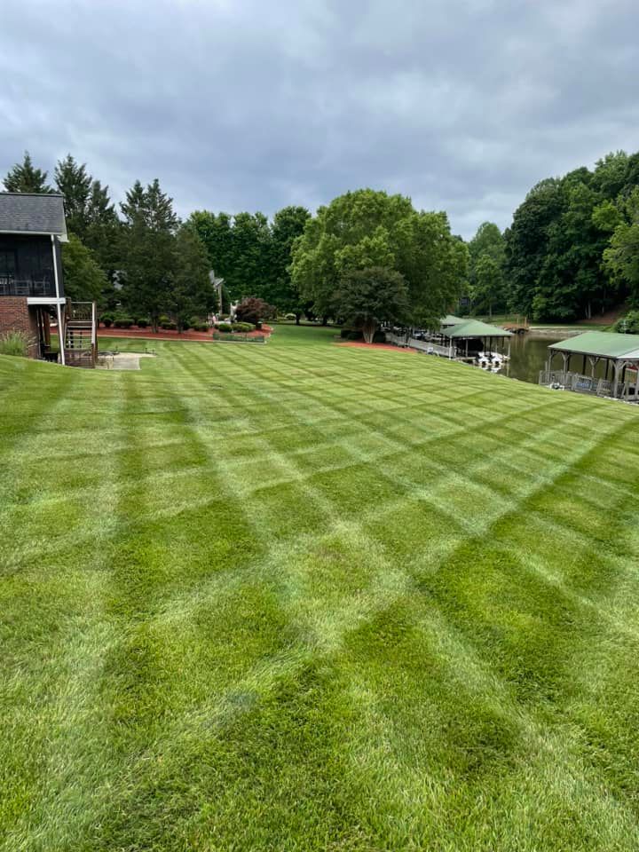 We offer professional mowing services to keep your lawn looking its best. Our experienced team will make sure your lawn is healthy and well-maintained all season long. for Reiser Lawn Service in Denver, North Carolina