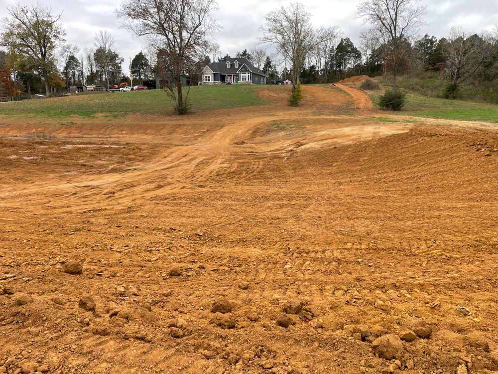 Our Land Grading service ensures your property has a level, stable foundation for construction, improving drainage and preventing erosion, while enhancing the safety and appearance of your landscape. for TrottCo Excavation in Shelbyville, TN