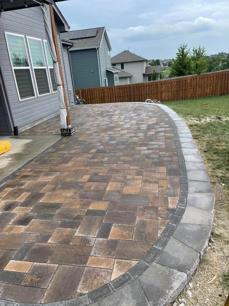 Our Patio Design & Construction service offers homeowners the expertise and skilled craftsmanship needed to create a beautiful outdoor living space that seamlessly blends with their existing landscape. for Hardscapes of Nebraska in Arlington, NE