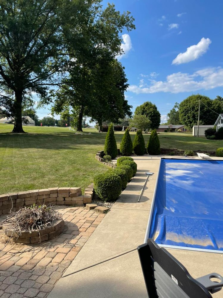 Enhance your home's curb appeal with our expert shrub trimming service, ensuring healthy growth and a polished look. Our skilled team shapes and maintains shrubs for beauty and vitality year-round. for Chapmans Lawncare and Landscaping in Connersville, IN
