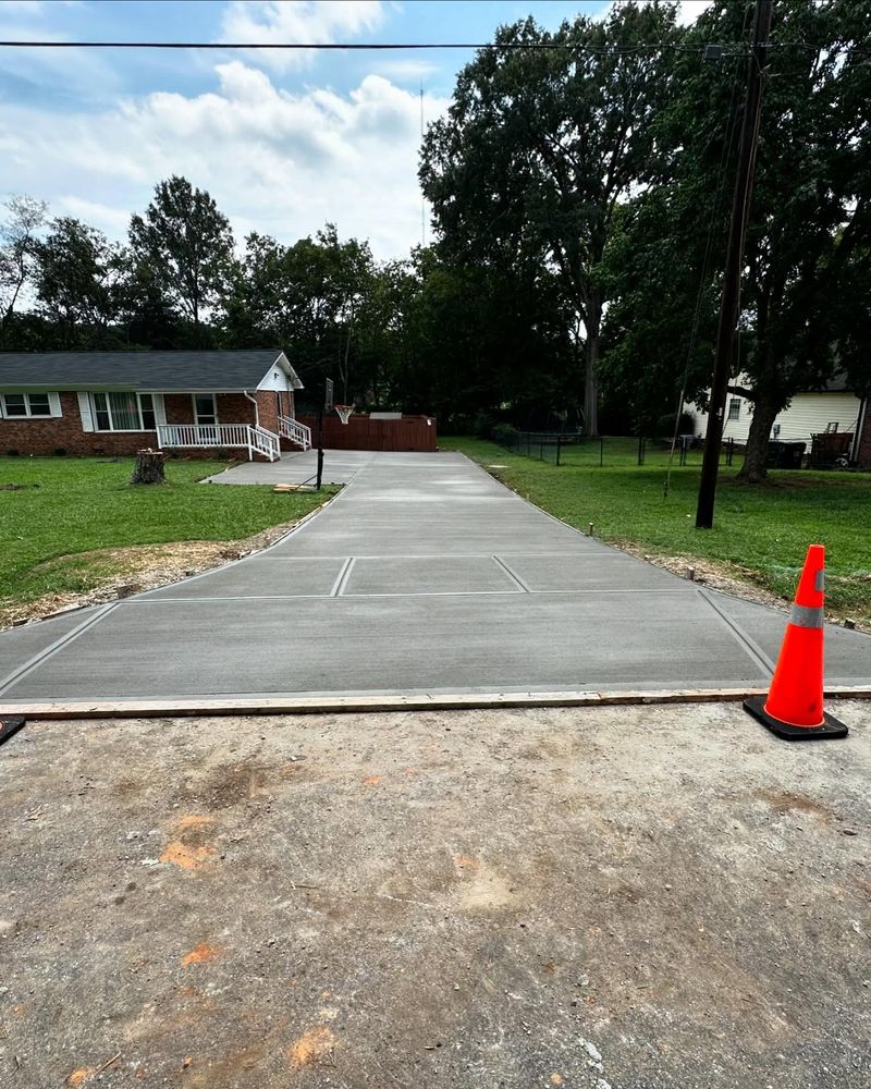 Transform your home's curb appeal with our top-notch Driveway Construction service, offering durable and aesthetically pleasing concrete driveways that enhance functionality and add value to your property. for GNE Construction in Concord, NC
