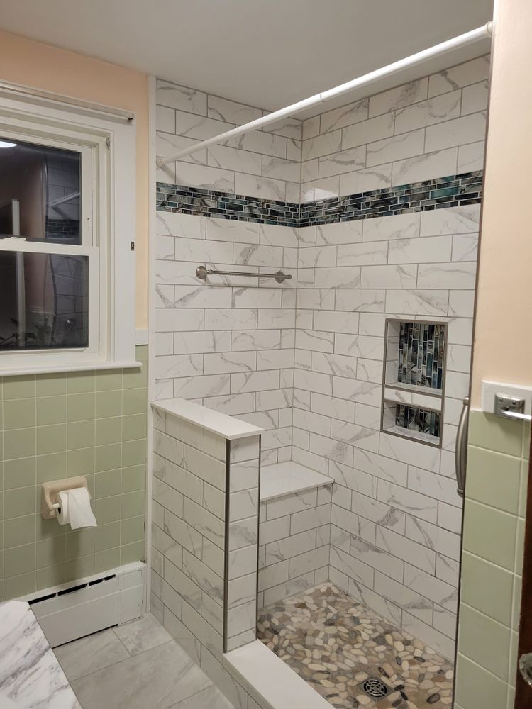 Transform your bathroom into a stunning oasis with our expert renovation service, offering quality craftsmanship and customized designs to enhance functionality, comfort, and style for your home. for Jetstream Construction in Gorham, ME
